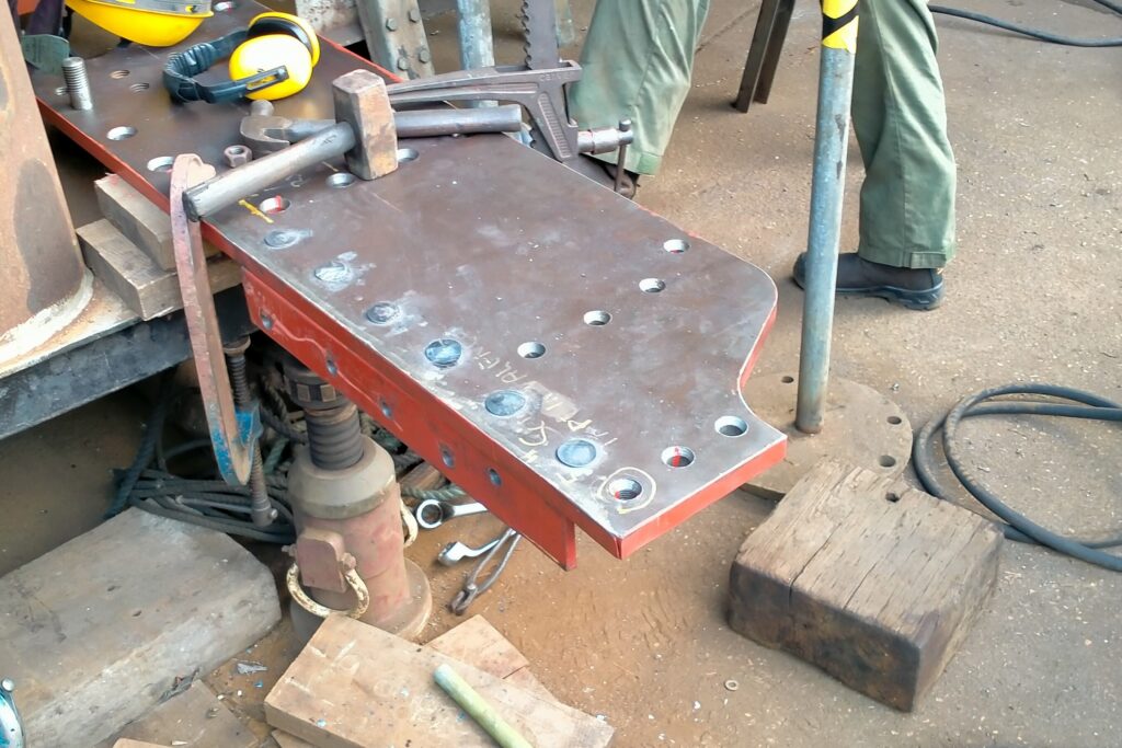 Barry, Andy and I have riveted the angles in place while Liam has completed the new studs for the rubbing block. The next step will be riveting the beam to the chassis after the steam gala.  