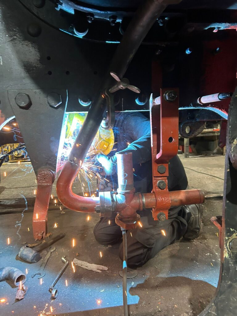 Welding on pipework under the cab.